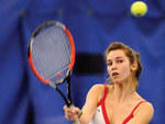 94. Dominate the baseline at an indoor tennis court