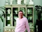 What a bust: Gentet poses in front of his collection of white dishes and statues