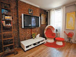 Exposed brick, mod furniture and demure cats---what's not to love?