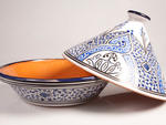 Hand-painted Tunisian Tagine This stunning azure-and-white pot is specifically made for cooking North African tagine, a spiced vegetable or meat braise, but it would be a shame to keep this earthenware pot in the cupboard. Your giftee can use this oven-to