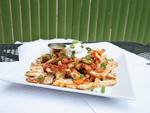 Miss McGrath's Irish nachos at Dram Shop This gloriously junky platter pays homage to Ireland's preferred starch, swapping tortilla chips out for excellent skin-on fries. The spuds are just crispy enough to survive the onslaught of melted white cheddar an