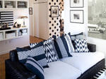 Szish replaced the pillows that matched the cushions of this Ralph Lauren rattan couch with Madeline Weinrib striped and ikat styles from the closeout section in the basement of ABC Carpet & Home (888 Broadway at 19th St (212-473-3000, abchome.com). "This