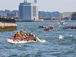 Watch a race around the harbor and fete the winners at a luau for the Liberty World Outrigger Competition
