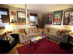 "Technically, it's a heat riser," says David, referring to the metal rod in the middle of his living room. "But in the summer, people dance all over it. It's sturdy and not going to fall down if someone is having a good time on it." A stripper pole wouldn