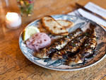 Grilled sardines at St. AnselmThose  who enjoy the elemental pleasures of the grill will love these  flame-licked sardines. Head chef Yvon de Tassigny works the fish just  right---a slick of citrusy ponzu sauce, a quick char over the smoky fire,  and a bi