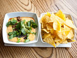 Nitehawk Queso at Nitehawk CinemaChef  Saul Bolton (Saul, the Vanderbilt) conjures creative updates on  concession-stand snacks for this gastro-cinema. Our favorite is this  Lone Star state riff on junky nachos:  Velveeta, sour cream, and  Ro-Tel--brand d