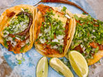 Al pastor tacos at Taco MixThe signature al  pastor pork is sliced directly from the spit at this Spanish Harlem  hole-in-the-wall, which is so tiny that you have to eat standing up.  You'll forget about the cramped quarters as soon as you taste that juic