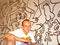 21. See the work of an iconic New York artist. Pictured: Keith Haring in front of his mural Once Upon a Time at the LGBT Center