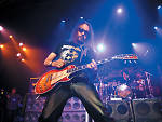 In this photo provided by Hard Rock Cafe, KISS guitarist Ace Frehley rocks New York's Hard Rock Cafe, Wednesday, Oct. 31, 2007, to celebrate Halloween and his new band.  (AP Photo/Hard Rock Cafe, Diane Bondareff)