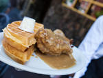 Smothered chicken and waffles at Sylvia's