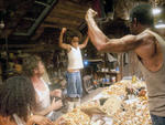 Quvenzhane Wallis, center, and Dwight Henry, far right, in Beasts of the Southern Wild
