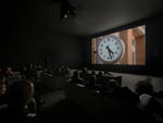 An audience takes in a scene from Christian Marclay's The Clock

