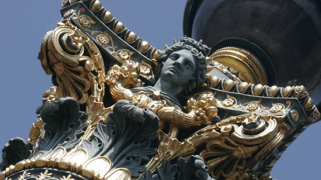 Stern times: A figurehead looks out on Place de la Concorde, where Louis XV lost his