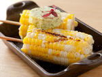 Corn on the cob with roasted garlic and jalapeno at Woodland