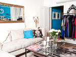 A geek-chic fashion designer details how she created her feminine, glamorous pad on a budget.