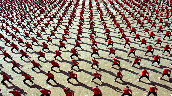 Monks train in sync in Ron Fricke's Samsara
