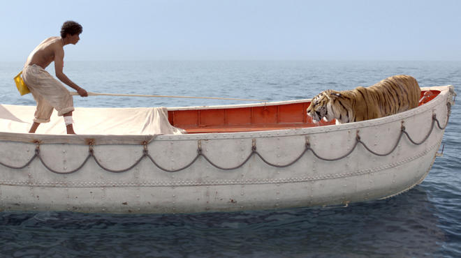 Suraj Sharma and a Bengal tiger named Richard Parker in Life of Pi