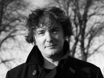 Black and white photograph of Dylan Moran