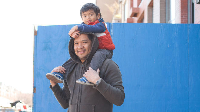 Public eye: John Divinagracia, 37,
and Santi, 3