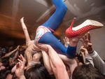 Callie W. crowd surfing during a Spank Rock show at Bodega. Bushwick, Brooklyn, 2009
