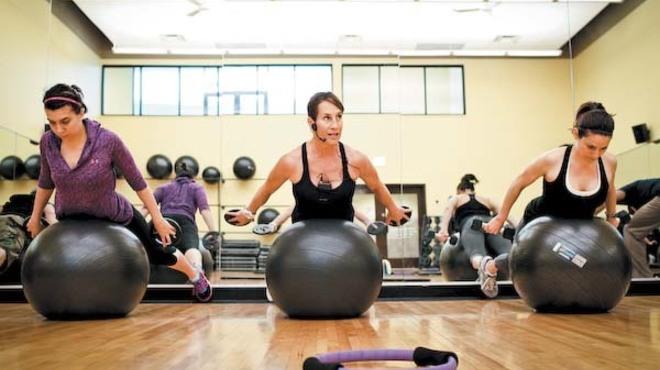 Lois Miller, center, leads a Body 360 class on Wednesday at FFC gym's East Lakeview location.
