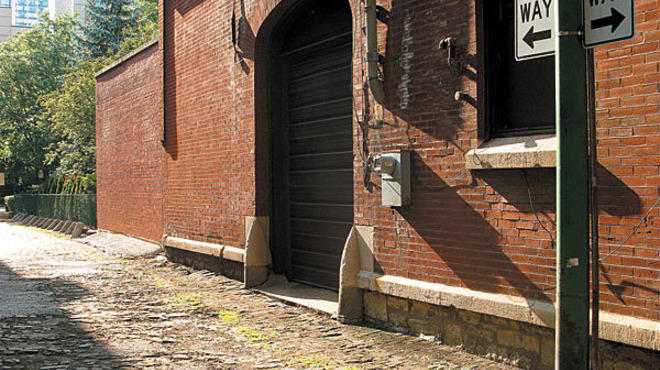CHIP OFF THE OLD BLOCK Though the wood pavers are crumbling, plans are under way to restore this Gold Coast alley to its former glory.