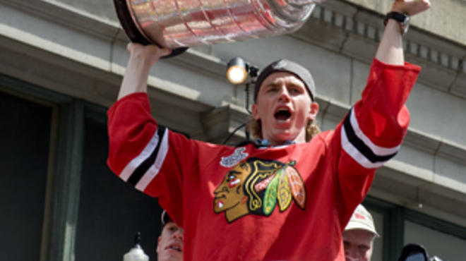 Chicago Blackhawks: Patrick Kane hoists the Stanley Cup aloft during the 2010 victory parade.