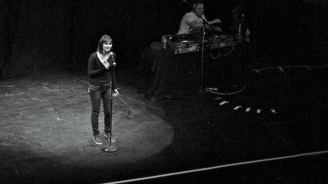 Isabel Kesheshian of Maine East performs as part of Louder Than a Bomb.