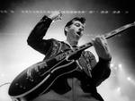 Arctic Monkeys serve up songs from their new album, AM, at the Riviera Theater on September 23, 2013.