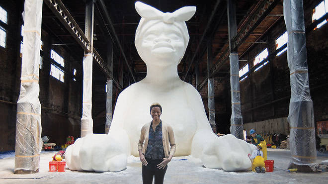 Karen Walker in front of her installation in progress at the Domino Sugar Factory in Brooklyn
