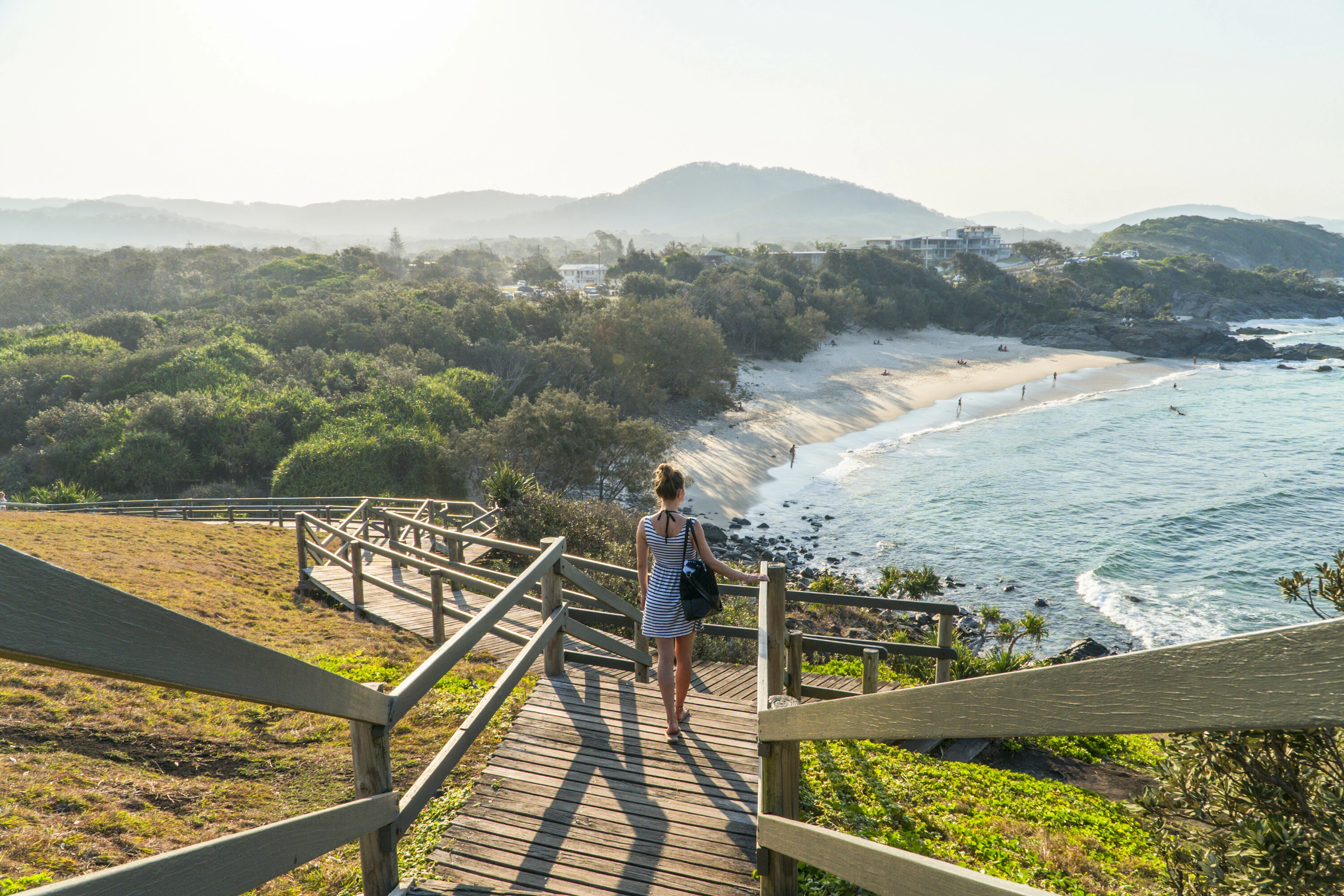 Woman enjoying the scenic view of Cabarita Beach from Norries Head.