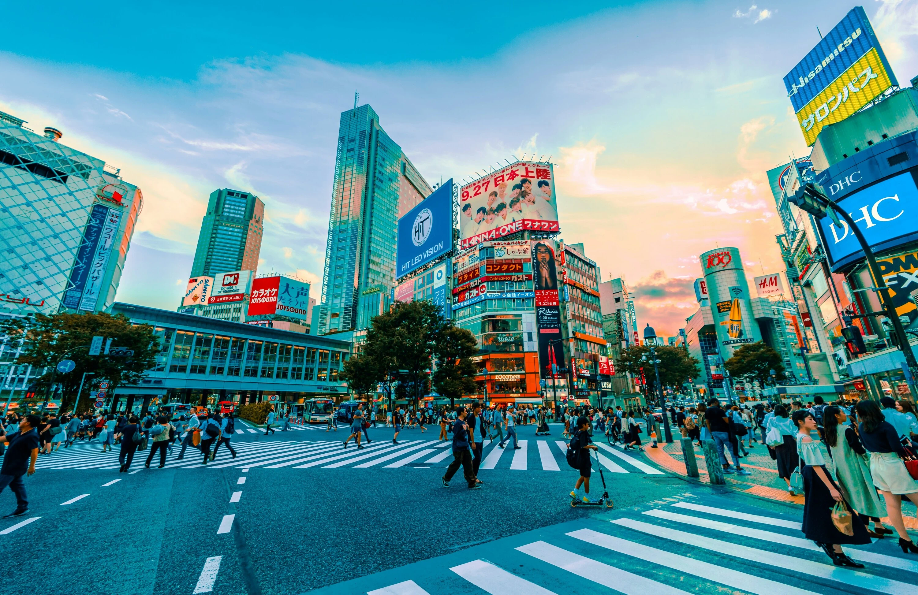 Shibuya crossing with bright lights and people