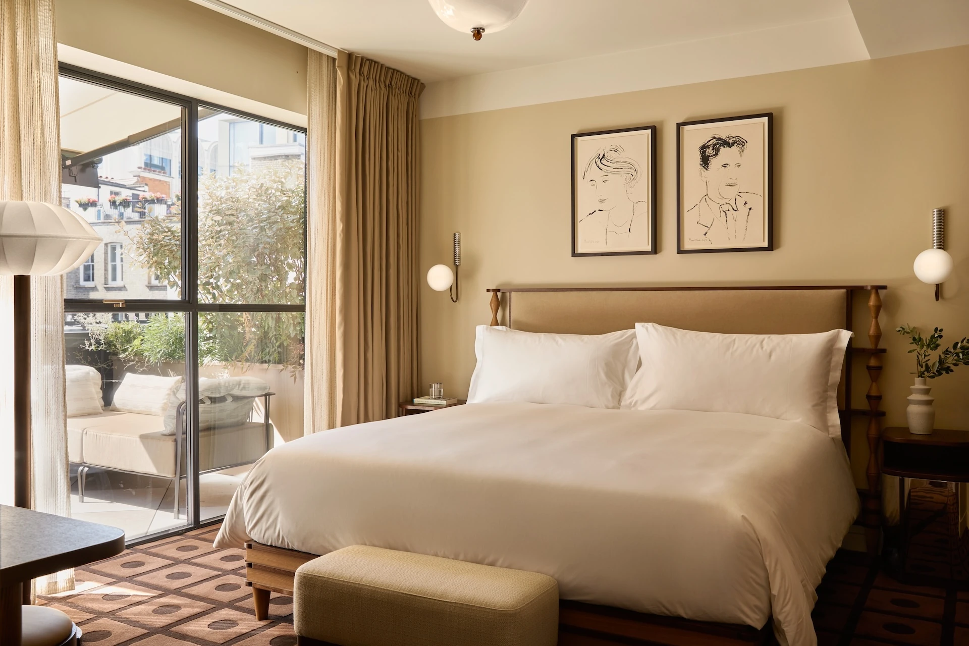 A bedroom with a private terrace at The Newman