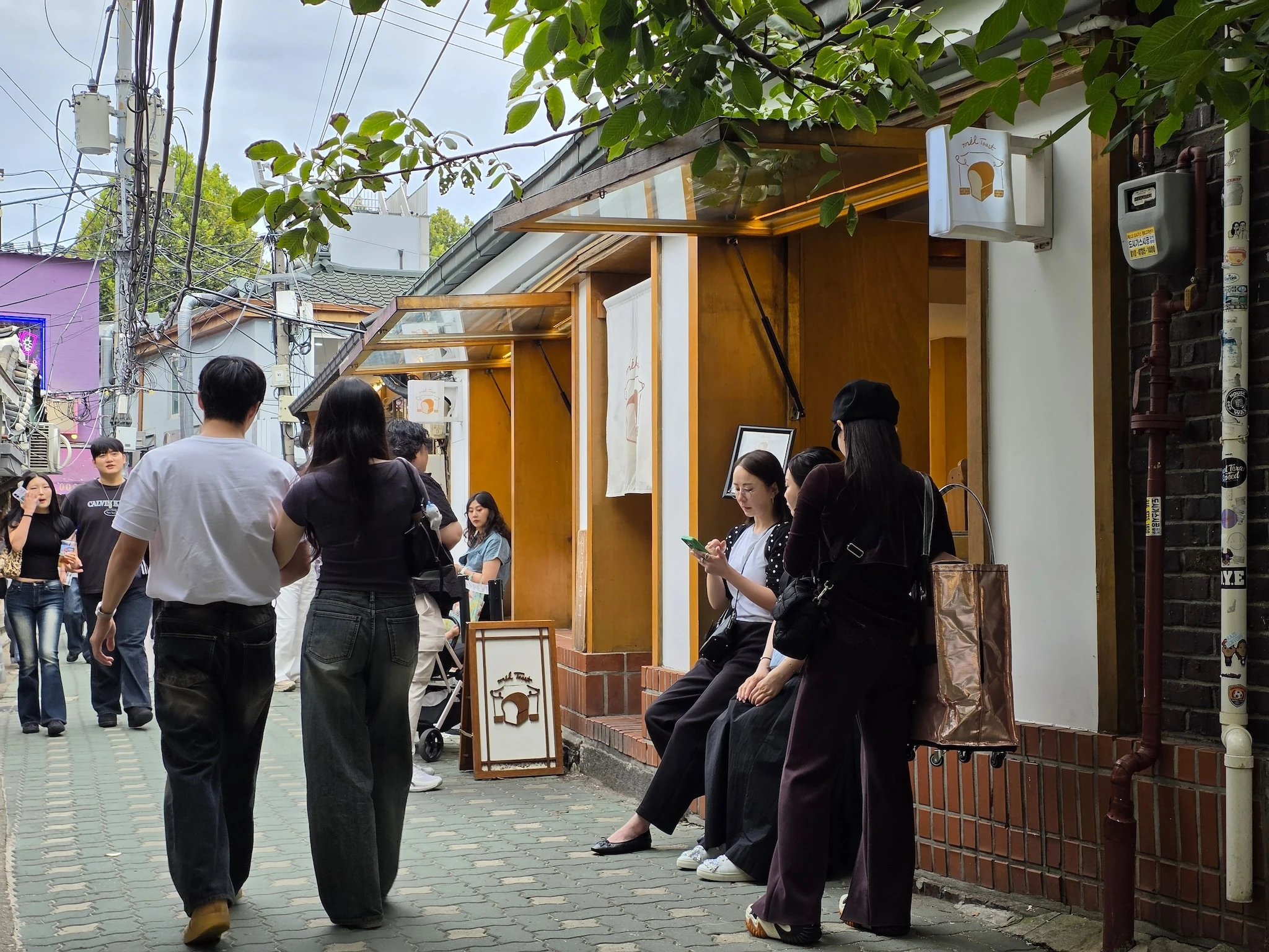 People hanging out outside Mil Toast bakery in Jongno 3-ga in Seoul