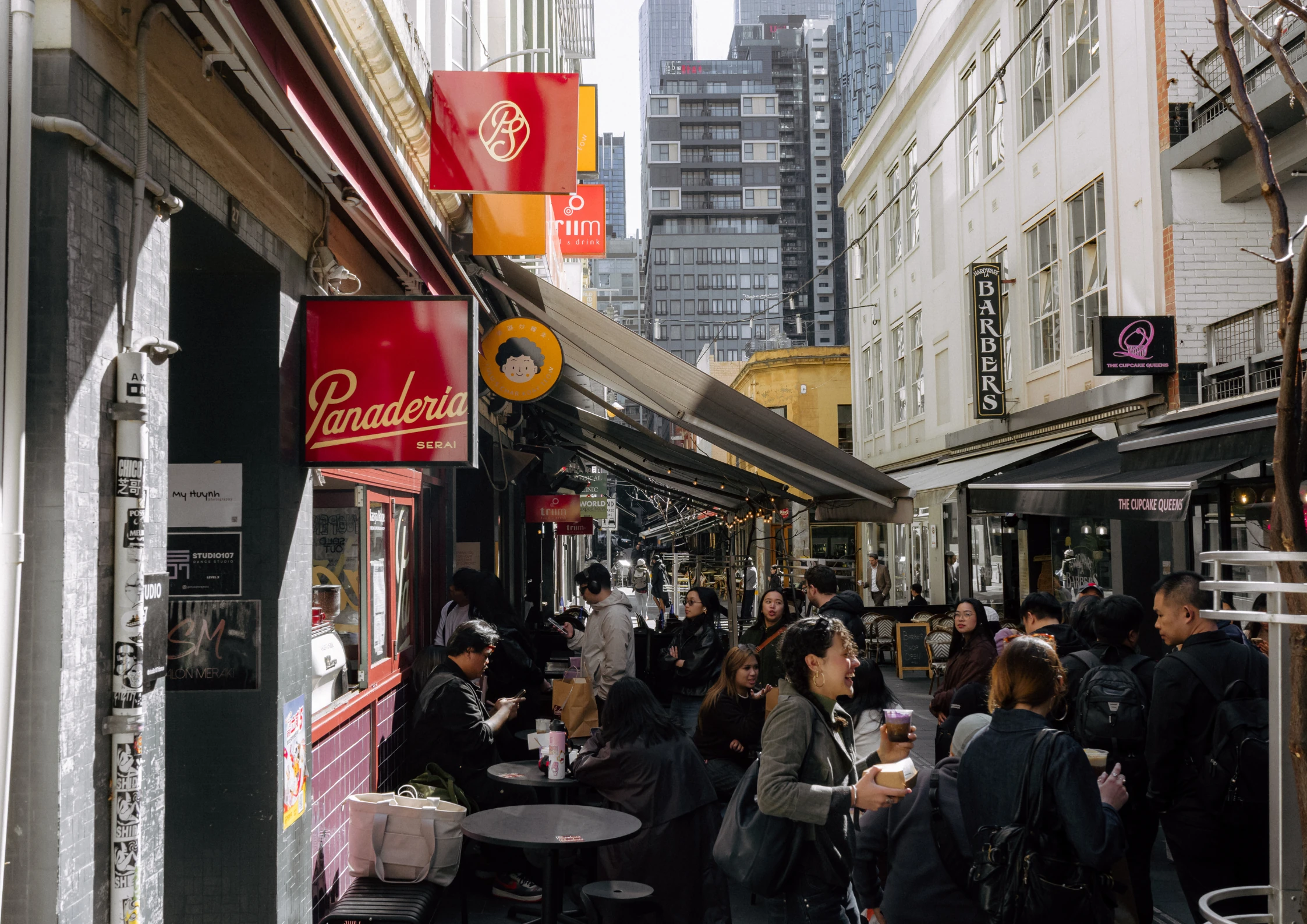 People gathered in a Melbourne laneway around a new bakery.