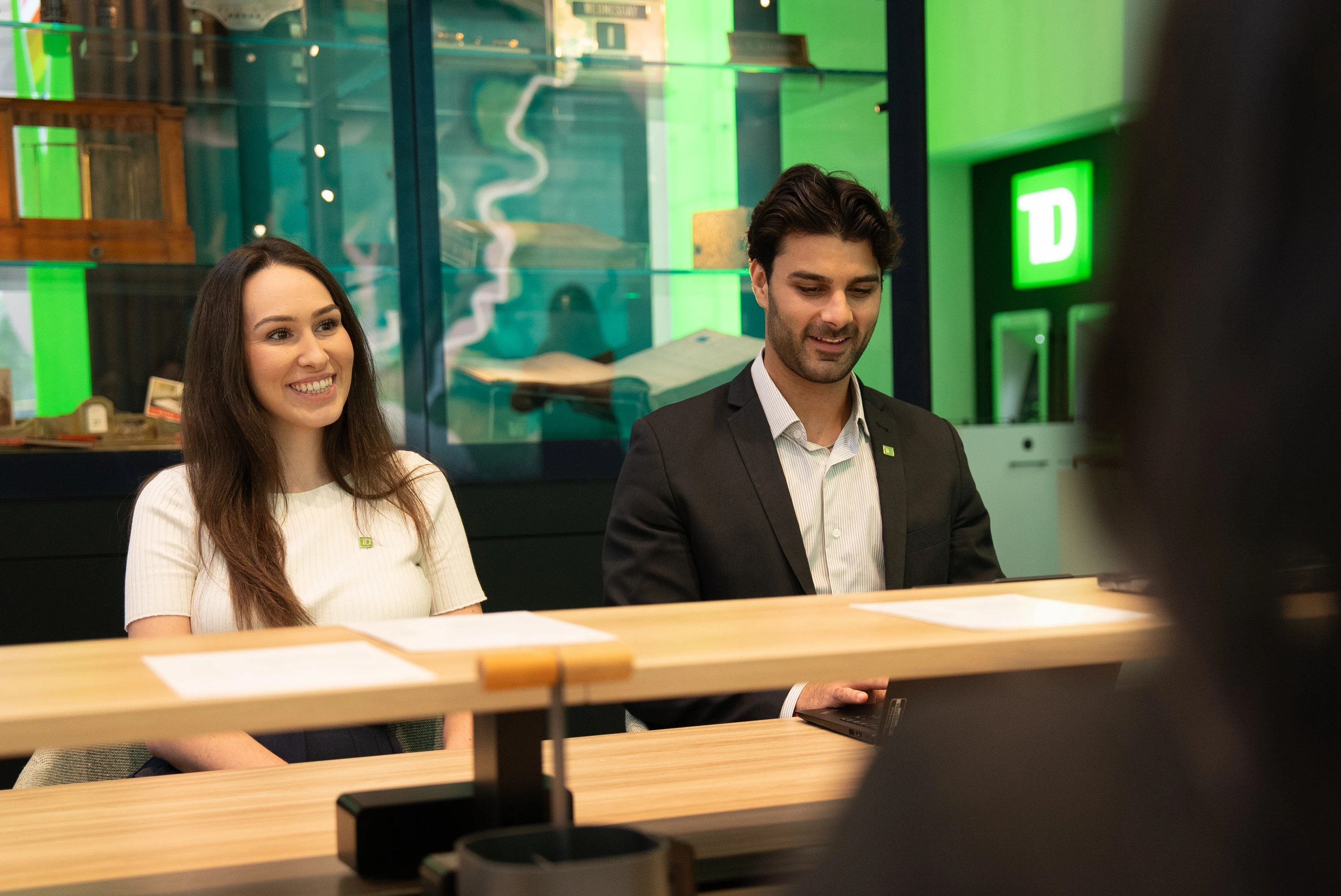 Two people sitting with a TD Bank manager