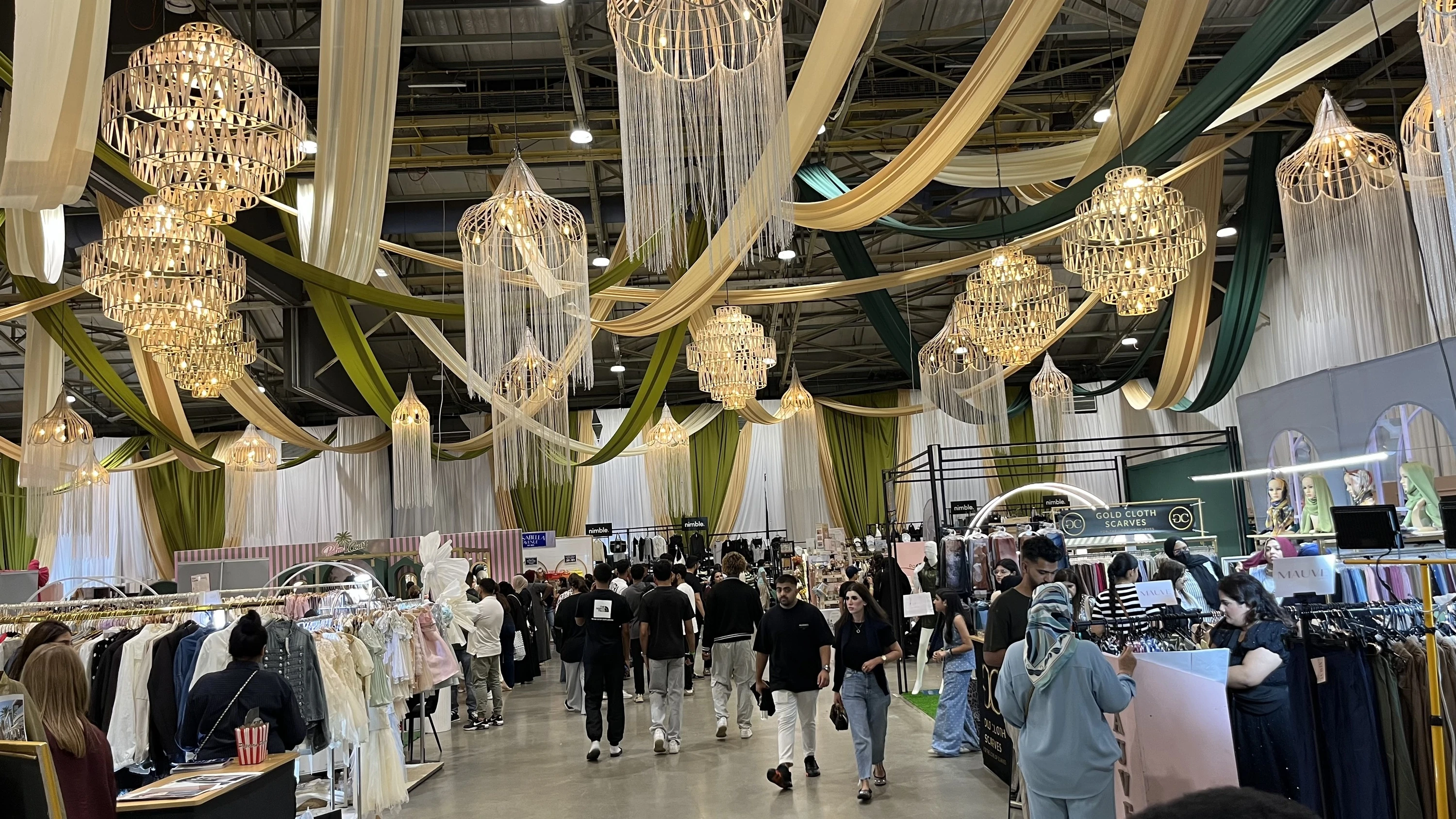 Fabric draping and woven pendant lights gave the busy exhibition hall its country club look.