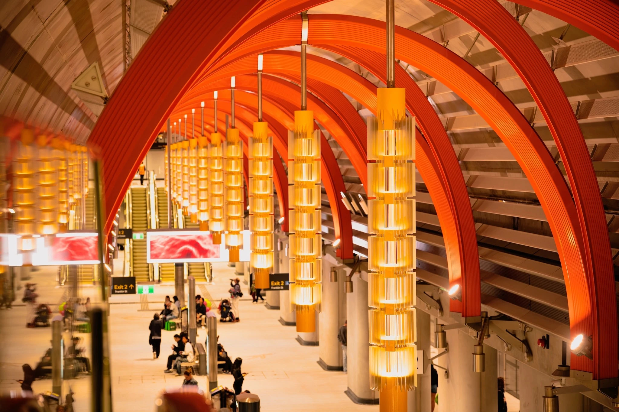 Scenic view of the newly opened Town Hall Station in Melbourne, with a group of people waiting at the platform