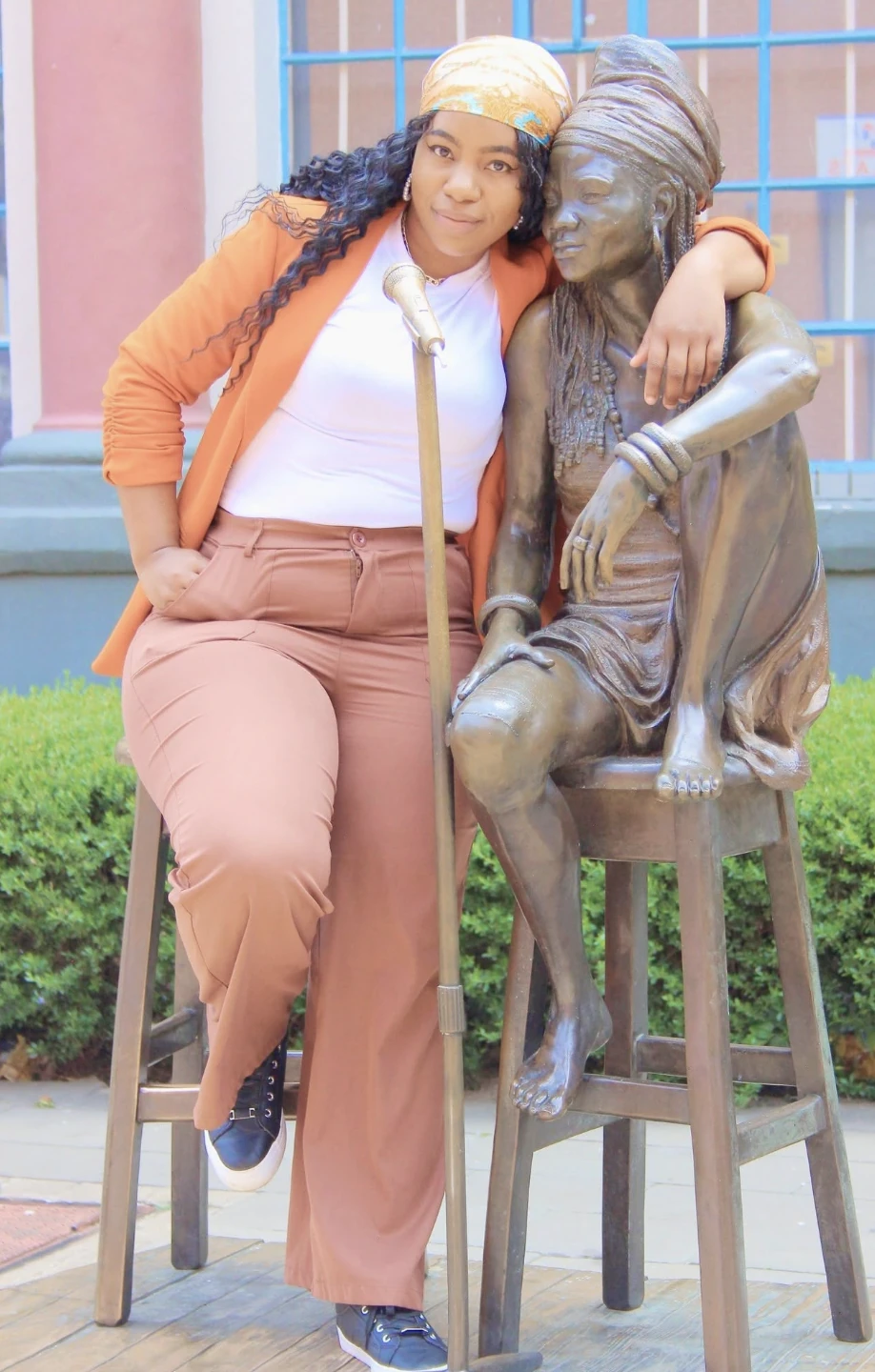 Nonkululelo Sibeko with the iconic Brenda Fassie statue outside the Market Theatre in Newtown.