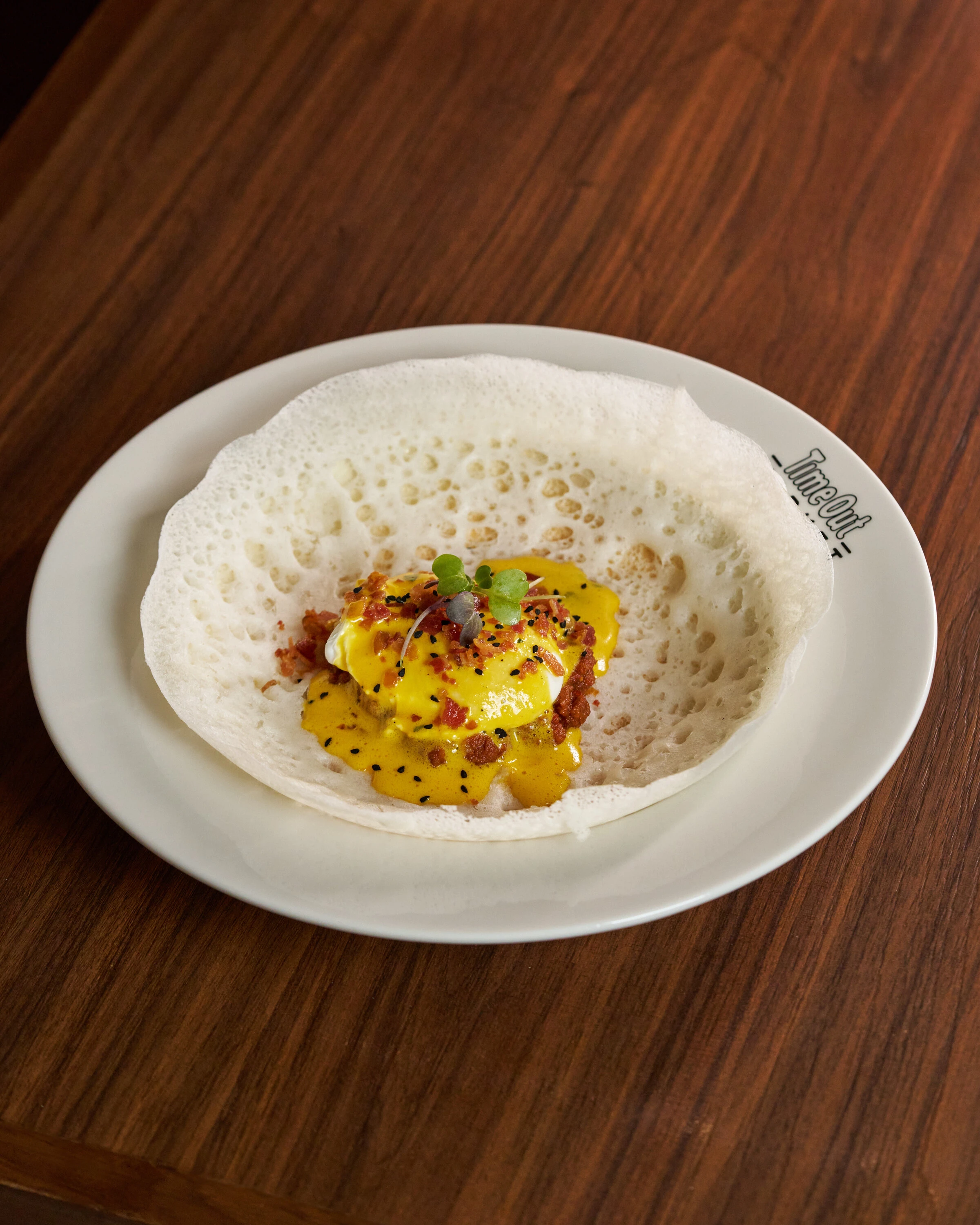 Eggs Appam Benedict by Bhawan