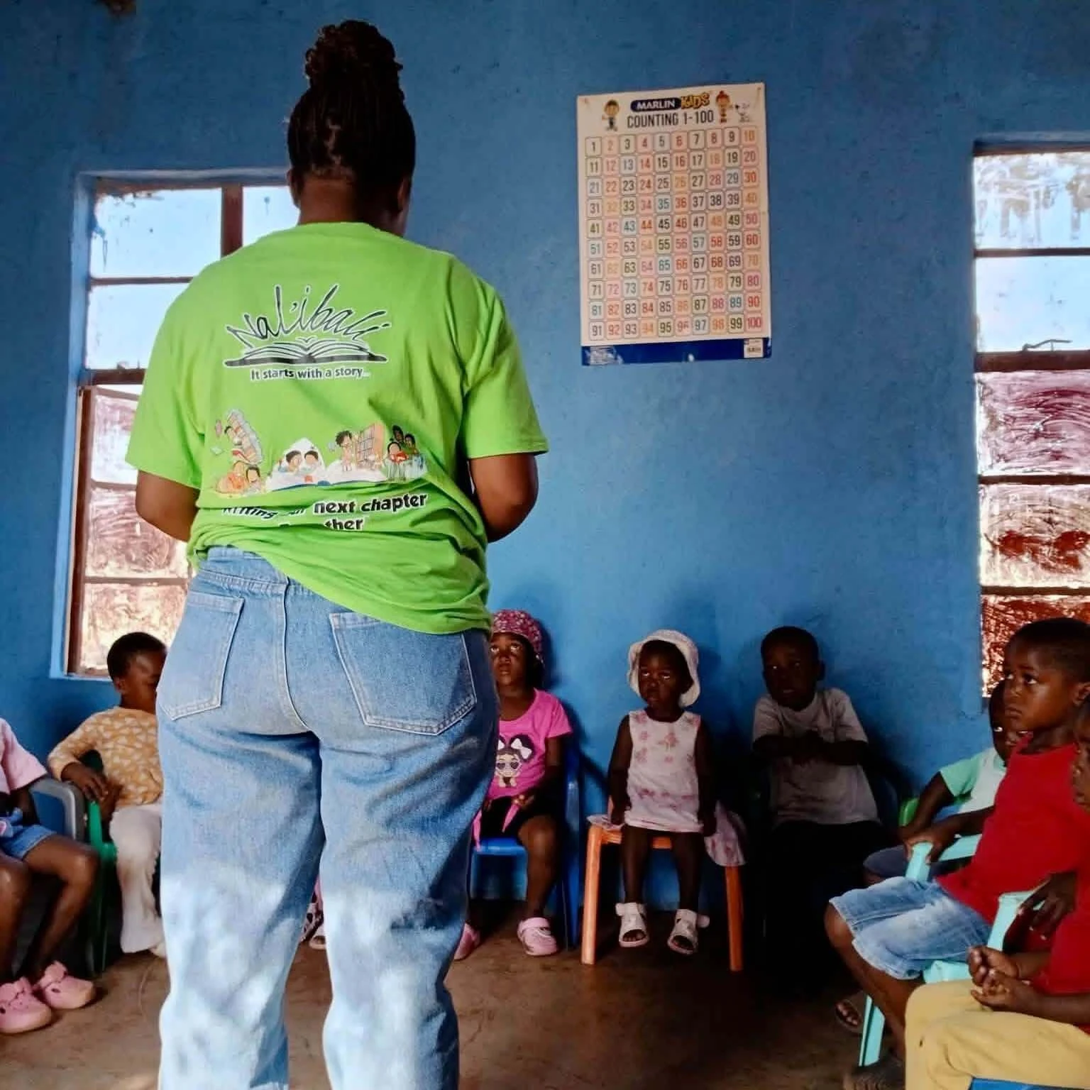Nal'ibali presenting an oral story to children in a classroom