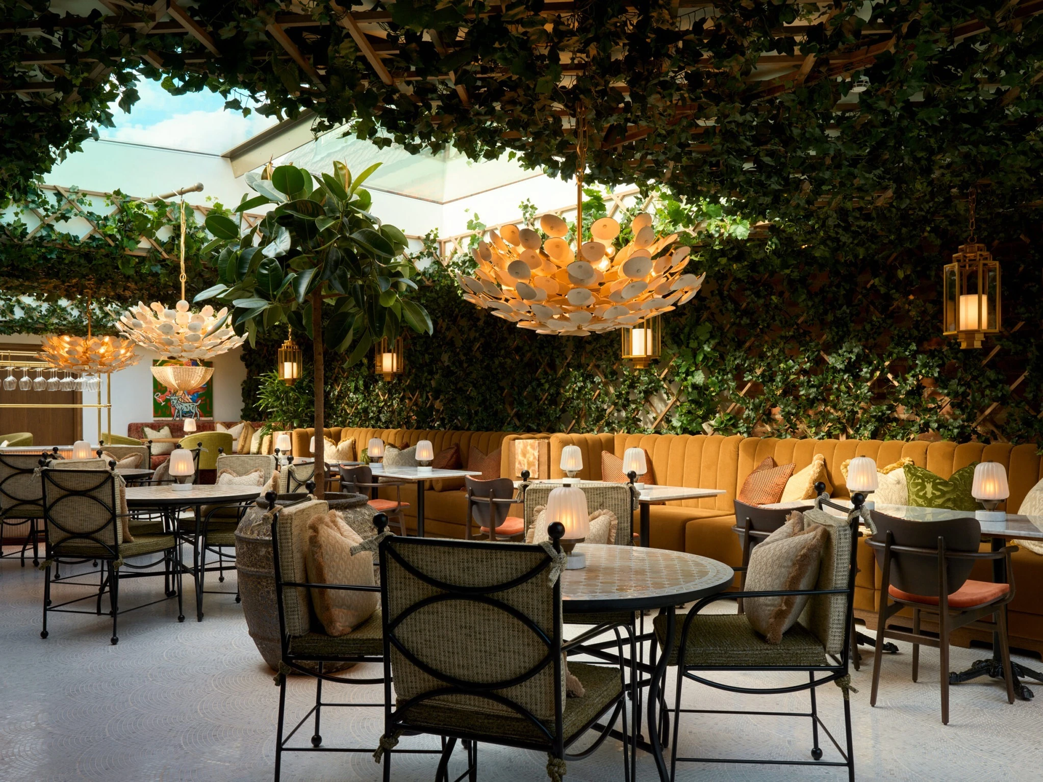 Interior and exterior views of the members&rsquo; club Villa Pauli in Djursholm, including the restaurant St. Nobl, the bar, the spa and gym, the pool terrace and a guest suite.