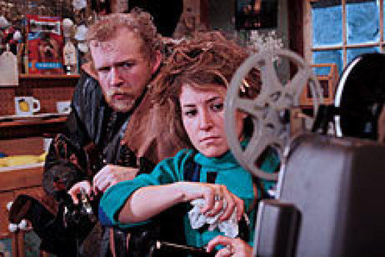BRING IN DA JUNK Thureen, left, and Bos study a busted projector.