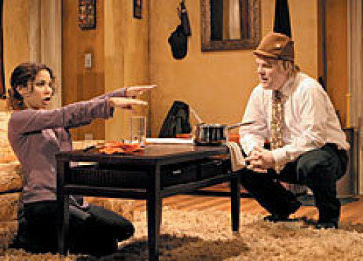 ARMS RACE Rubin-Vega, left, reaches out to Hoffman.