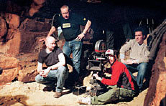 TUNNEL VISION Marshall, left, supervises a camera set-up in the catacombs.