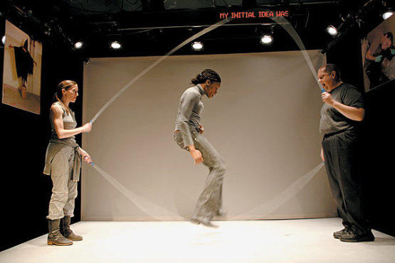 MONEY SHOT Okpokwasili, center, jumps rope for dollars.