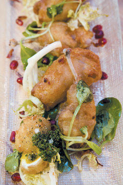 Fried quail with pomegranate-bacon vinaigrette
