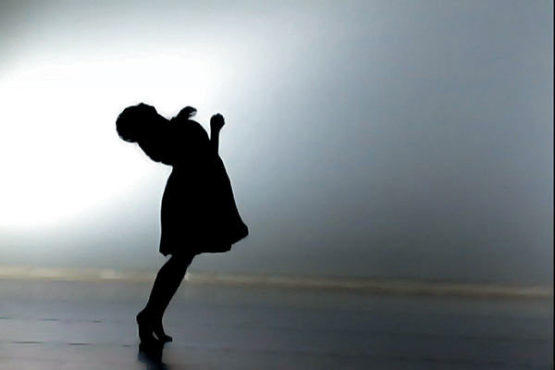 SHADOW DANCING Emily Wexler, a Hollins graduate, is captured in silhouette.