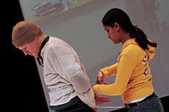 OFF THE CUFFS Security guard Marcia Hidalgo loosens Fletcher's bonds.