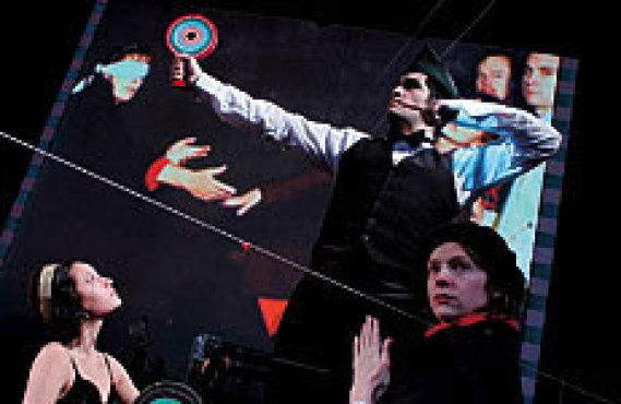 MOTION PICTURES Live actors pose against Foreman's video.